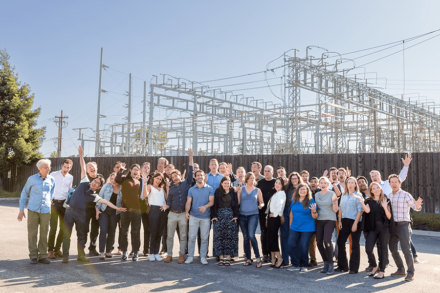 The Camus team standing in front of a substation.